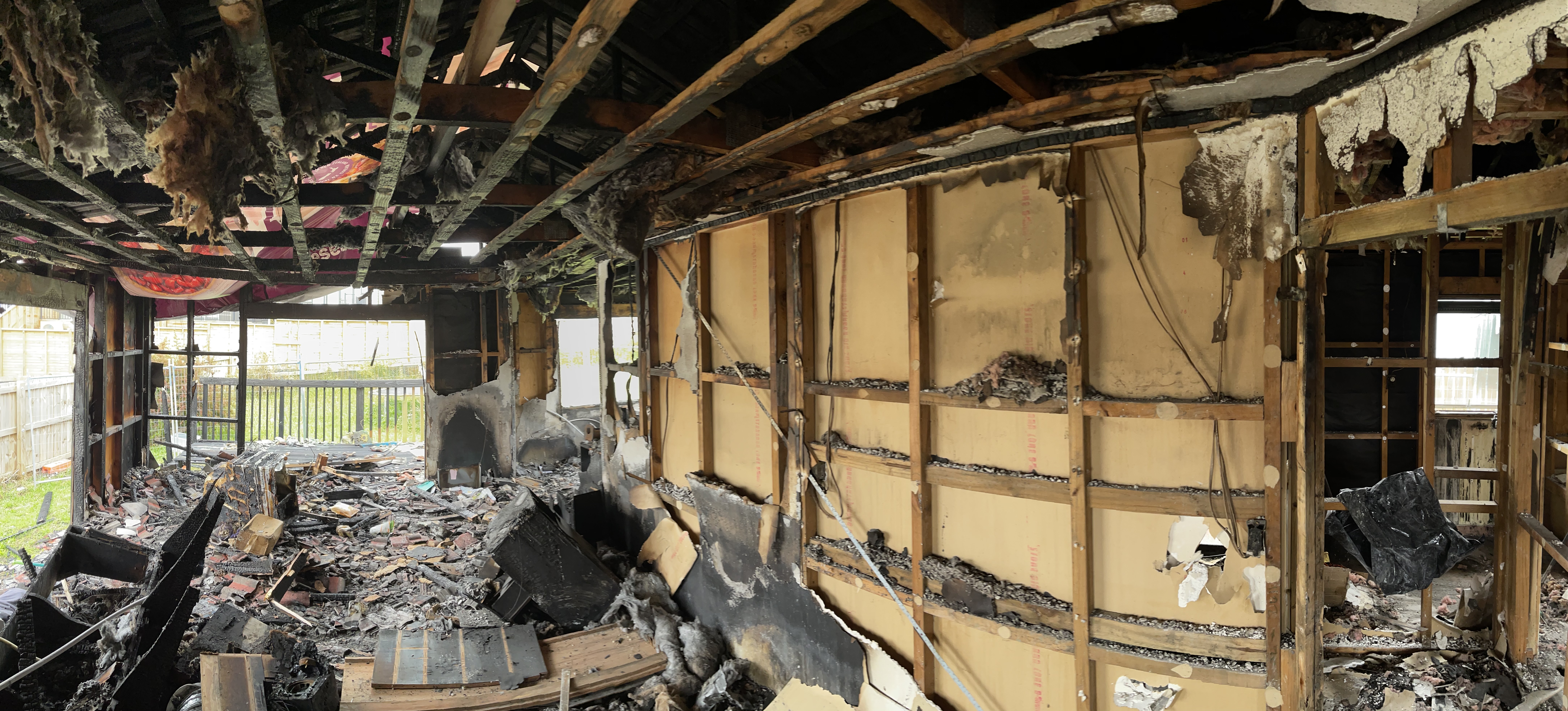 View of the lounge area of a fire damaged house before the remediation clean-up starts.
